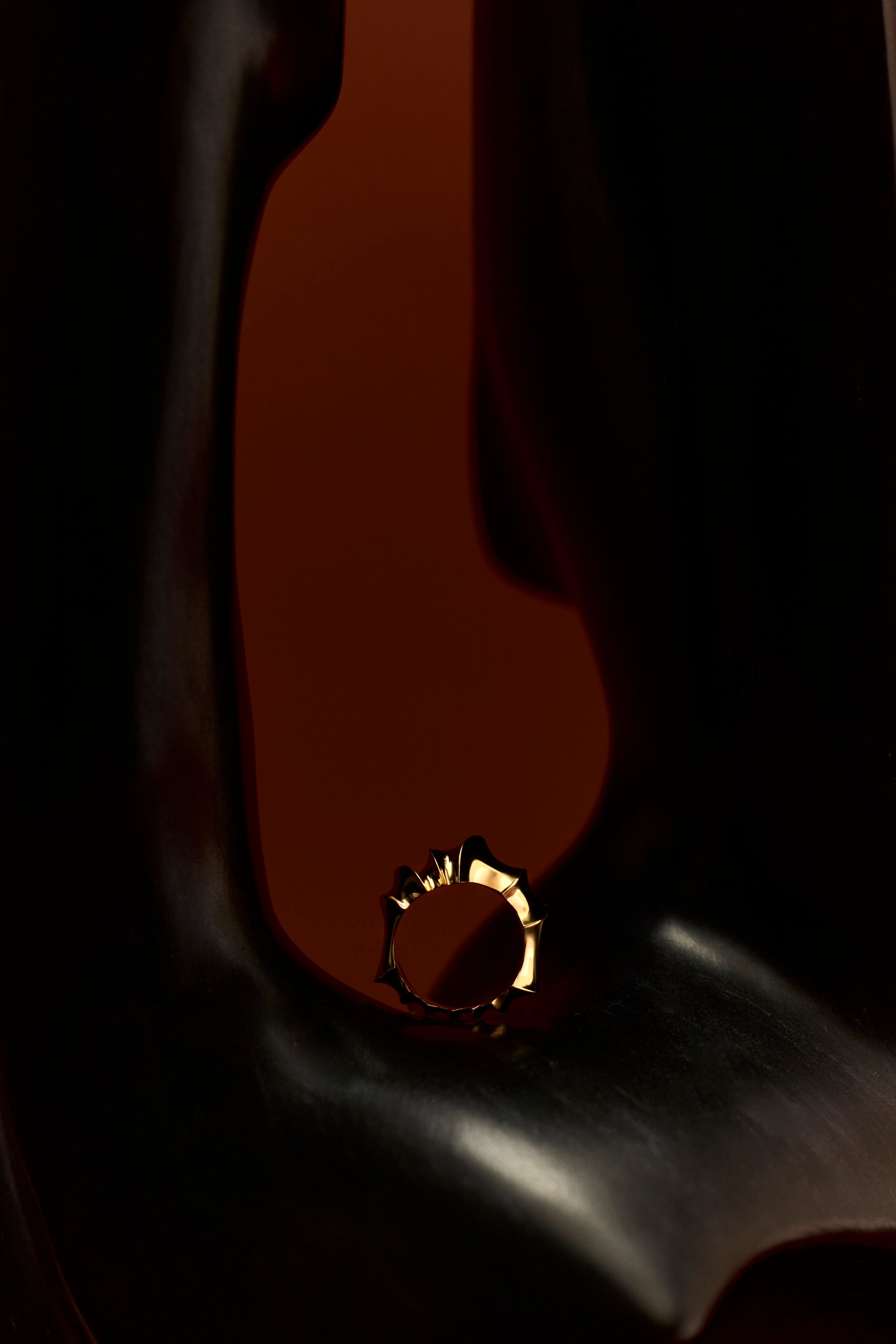Rogue Ring sculpted in bronze with bold asymmetrical contours, finished in 24k gold plating