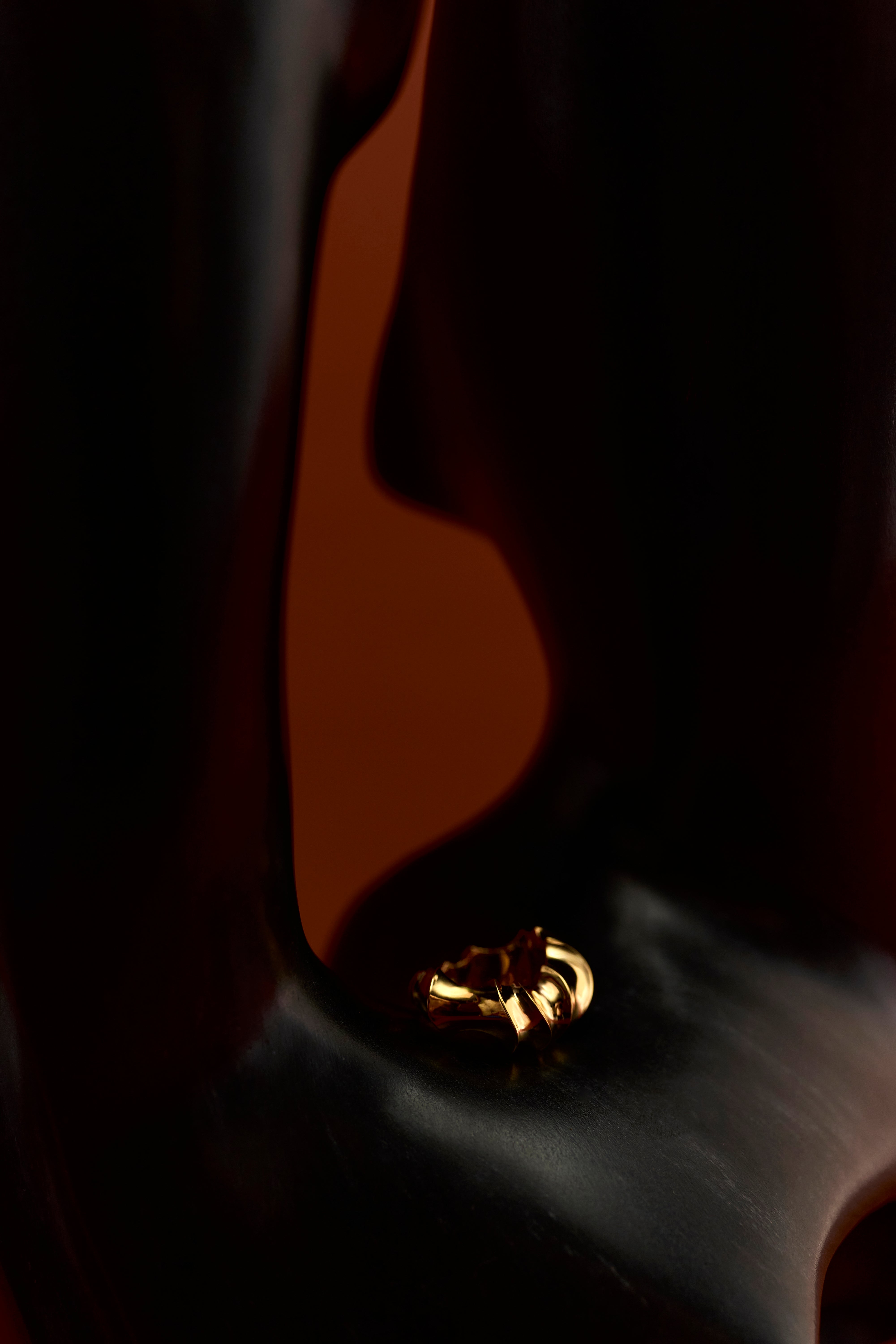 Rogue Ring sculpted in bronze with bold asymmetrical contours, finished in 24k gold plating