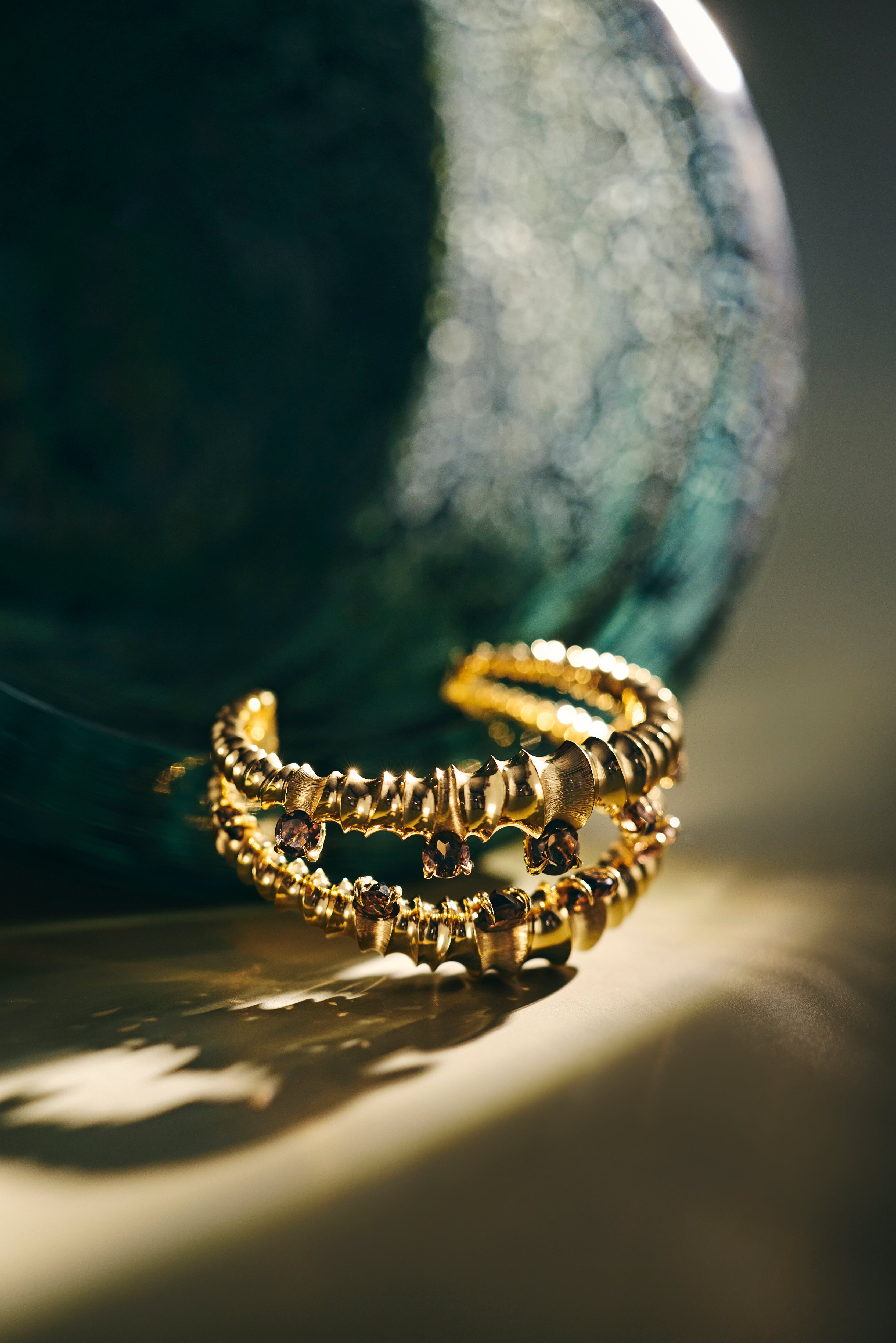 Silfra Cuff sculpted in bronze with Cognac Topazes set along crevice form, finished in 24k gold plating