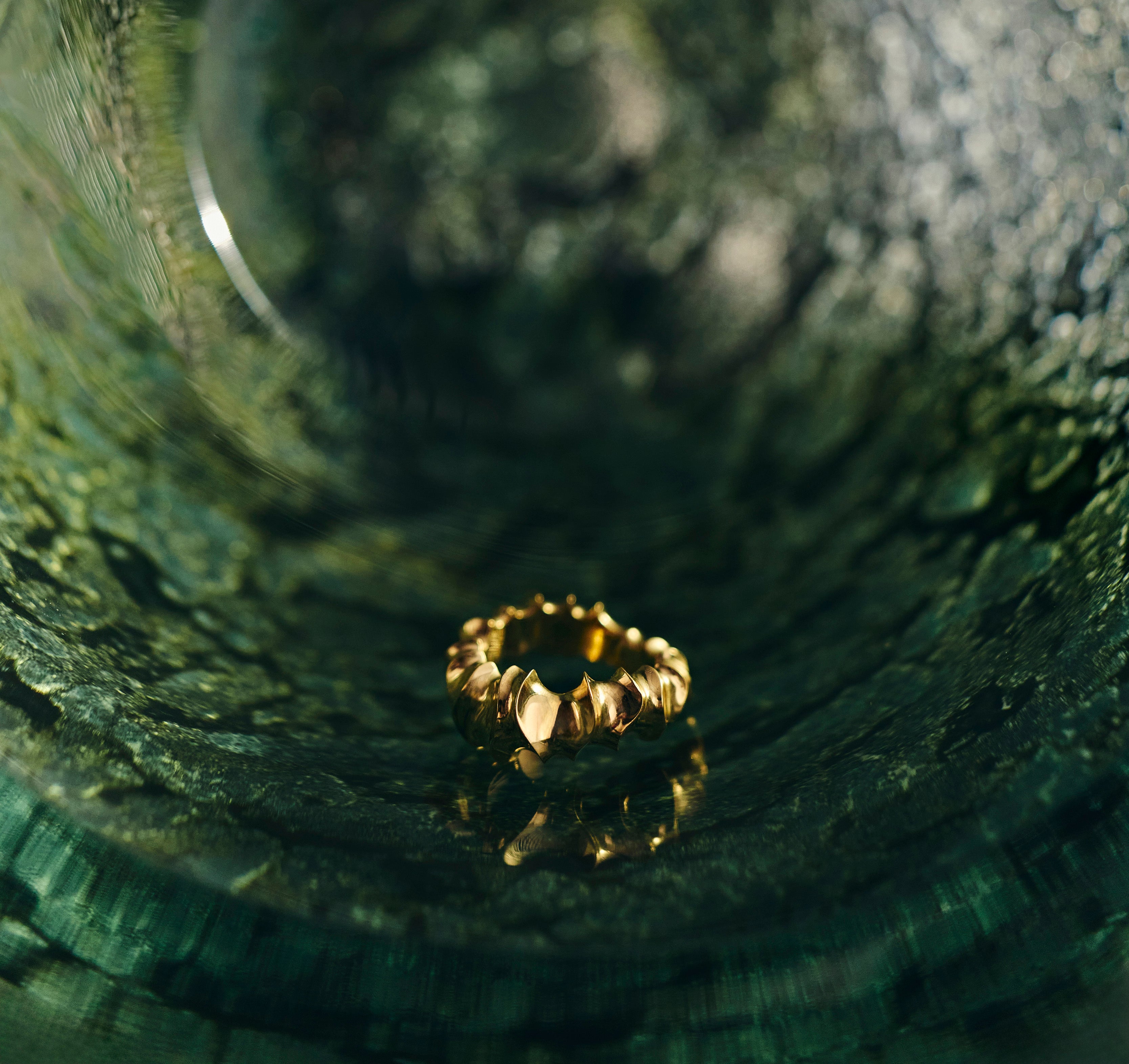 Haline Ring sculpted in bronze with slim continuous form, finished in 24k gold plating