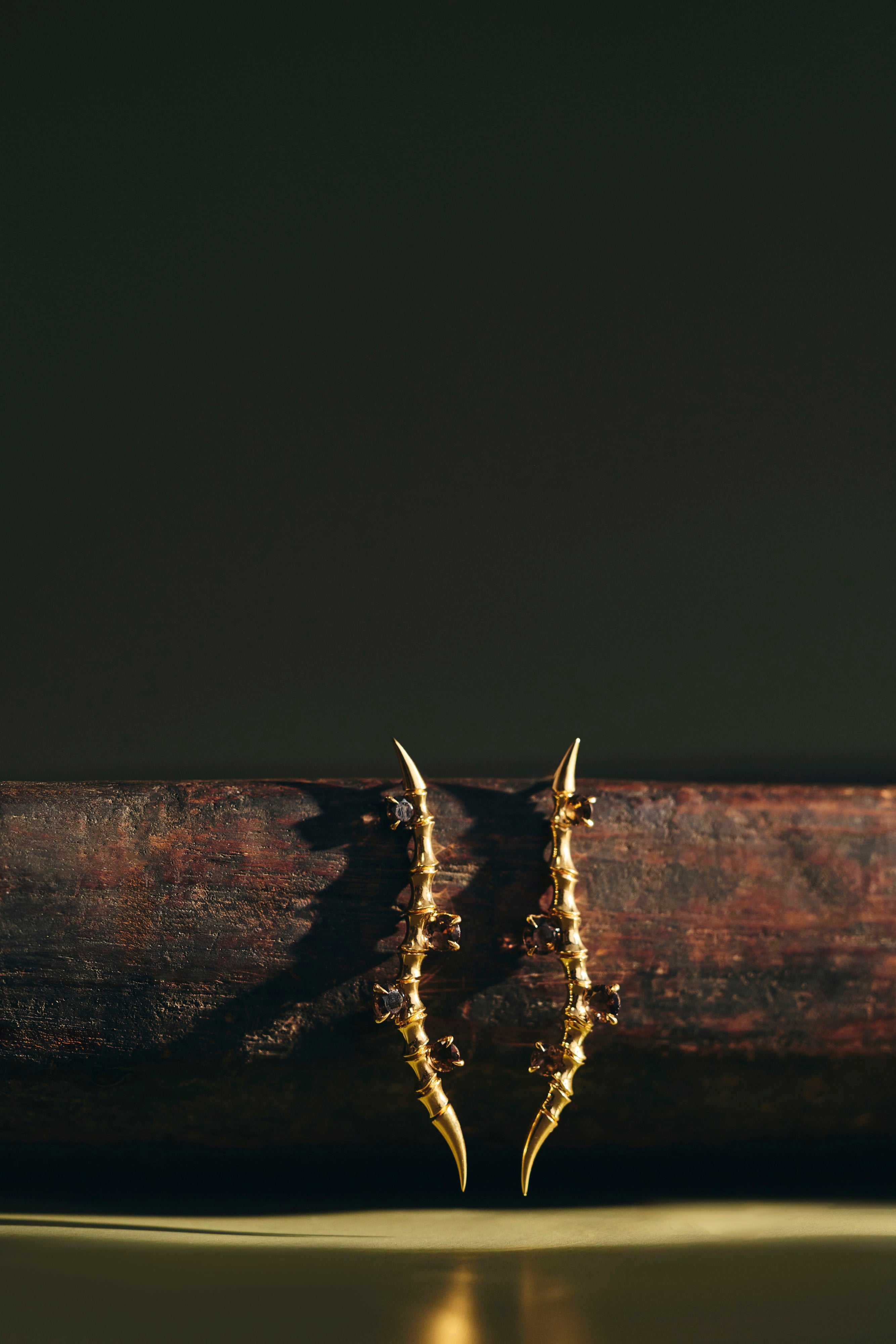 Strait Earrings sculpted in bronze with Cognac Topazes along flowing edge, finished in 24k gold plating