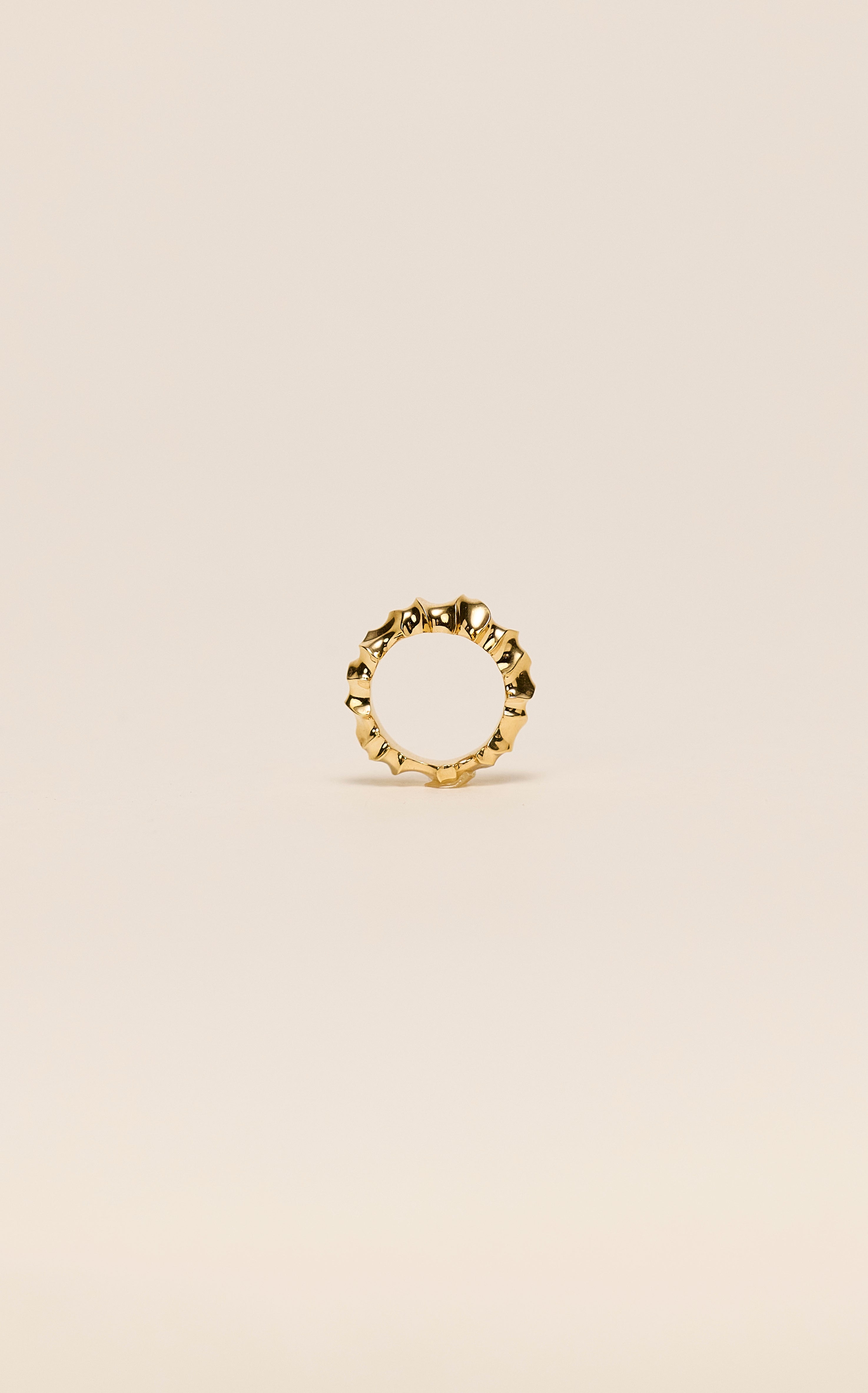 Rogue Ring sculpted in bronze with bold asymmetrical contours, finished in 24k gold plating