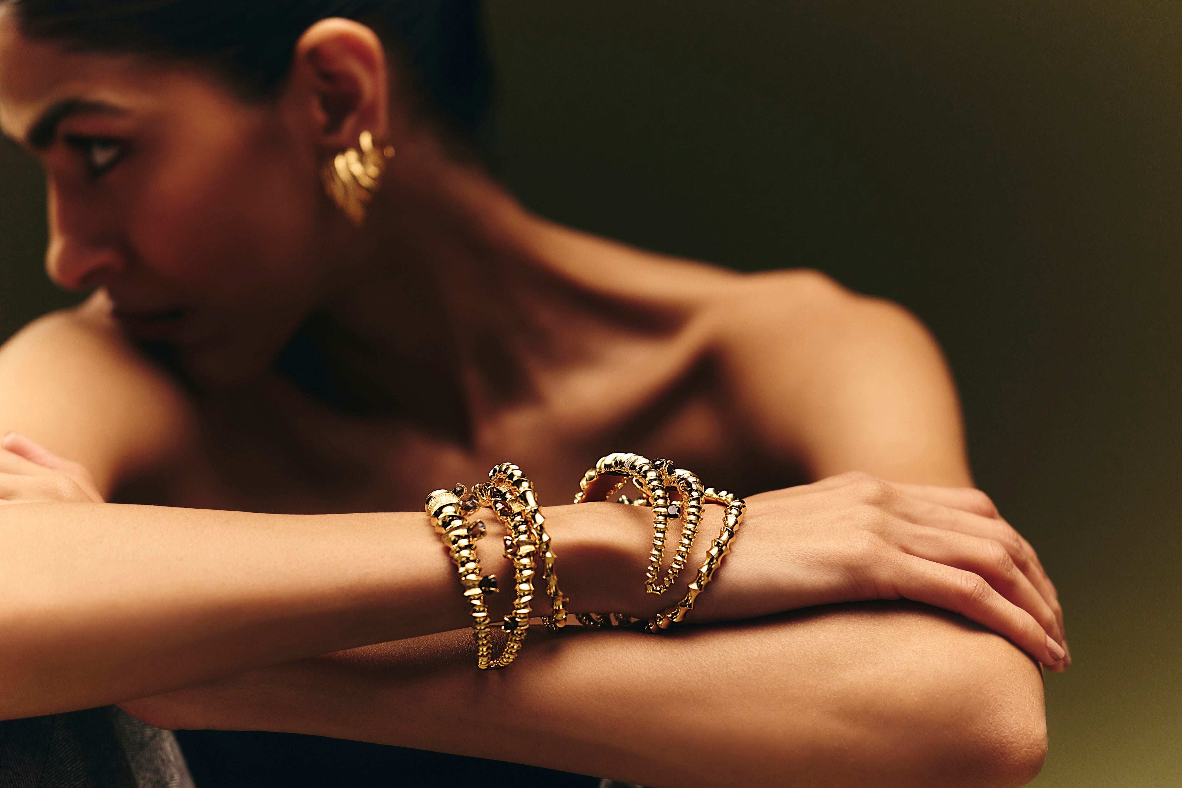 Seiche Cuff sculpted in bronze with rhythmic polished contours, finished in 24k gold plating